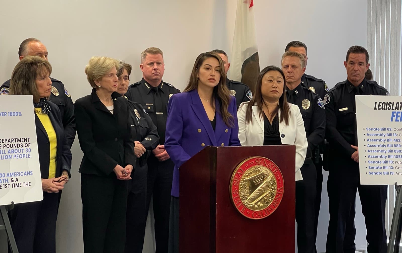 Perla Mendoza speaking alongside Seal Beach Police Department leadership